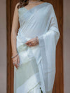 Pure White & Olive Green Handloom Cotton Saree with Minimal Striped Border & Tassel Detailing