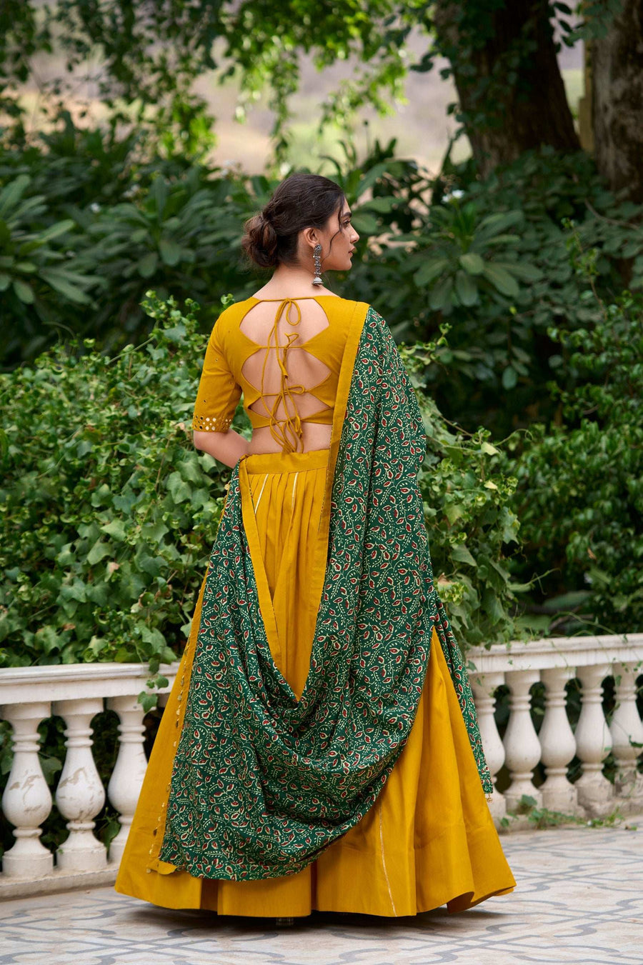 Full length view of black and mustard Navratri lehenga choli set with dupatta and purse - LNB