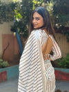 Off-White Pure Linen Digital Printed Saree with Striped Design and Unique Black Motif Pallu – Comes with Blouse Piece and Tassels