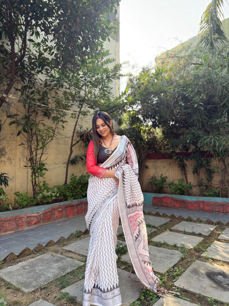 White Pure Linen Digital Printed Saree with Chevron Design and Intricate Red-Black Geometric Pallu – Tassel Details and Matching Blouse Piece