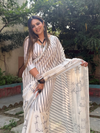Off-White Pure Linen Digital Printed Saree with Striped Design and Unique Black Motif Pallu – Comes with Blouse Piece and Tassels