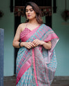 Aqua Blue Pure Cotton Linen Saree with Pink Border, Floral Motifs, and Tassel Detailing