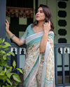 Ivory Cotton Linen Saree | Teal Border, Floral Print, Blouse & Tassel Edges – Buy Online