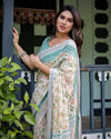 Ivory Cotton Linen Saree | Teal Border, Floral Print, Blouse & Tassel Edges – Buy Online