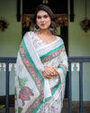 Ivory Cotton Linen Saree | Elephant Motif, Floral Print, Green & Pink Borders – Buy Online