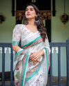 Ivory Pure Cotton Linen Saree with Elephant Motif and Floral Pattern, Green and Pink Borders, and Tassels on Edges.