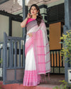 White and Pink Pure Cotton Linen Saree with Intricate Floral and Geometric Border Design and Tassels on Edges