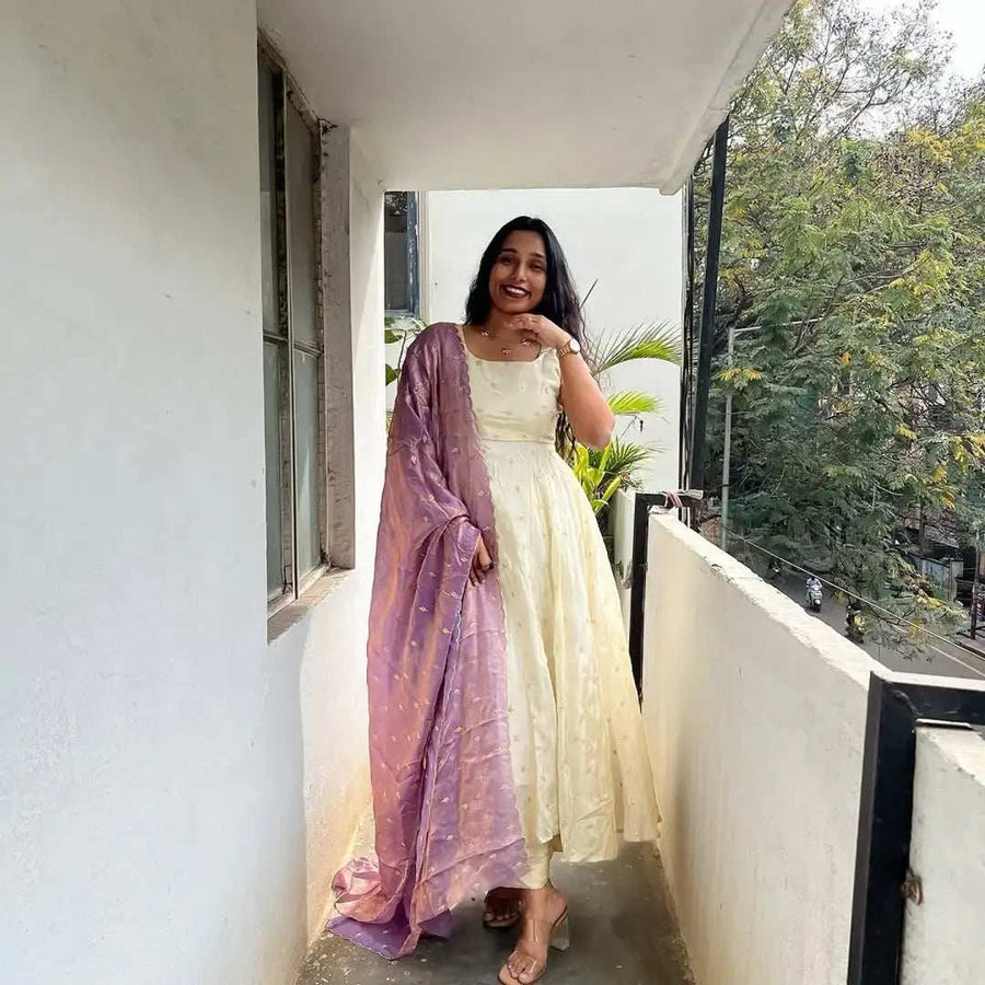 Close-up of subtle embroidery on cream Anarkali dress by Shree Roop