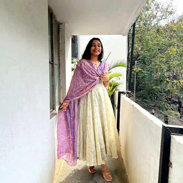 Cream Anarkali paired with lavender dupatta for festive wear - Shree Roop