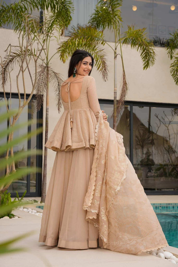 Close-up of champagne gold embroidered dupatta with sequin work on beige sharara set - Shree Roop
