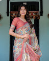 Rust Beige Handloom Cotton Saree with Vibrant Elephant Parade Print & Red Floral Pallu