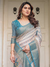 Off-White & Aqua Teal Traditional Printed Saree with Rich Zari Border & Tassels – Ethnic Festive Wear