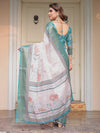 Pastel Lavender Floral Printed Saree with Teal Green Zari Border & Tassels – Festive Ethnic Wear