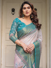 Pastel Lavender Floral Printed Saree with Teal Green Zari Border & Tassels – Festive Ethnic Wear