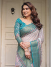 Pastel Lavender Floral Printed Saree with Teal Green Zari Border & Tassels – Festive Ethnic Wear
