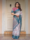 Ivory Floral Printed Saree with Rose Pink & Teal Blue Zari Border & Tassels – Festive Ethnic Wear
