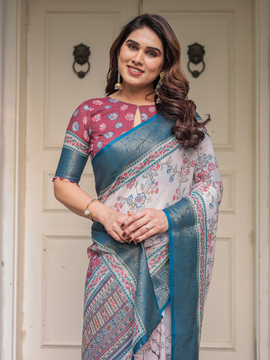 Ivory Floral Printed Saree with Rose Pink & Teal Blue Zari Border & Tassels – Festive Ethnic Wear