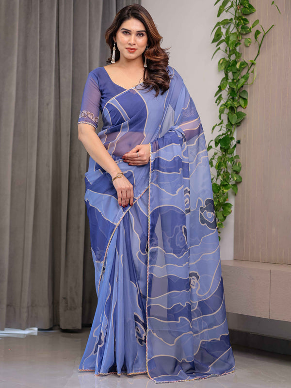 Steel Blue Printed Organza Saree with Abstract Wave Motifs & Multicolour Lace Border | Designer Lightweight Organza Saree with Attached Blouse Piece | Contemporary Festive Wear Saree