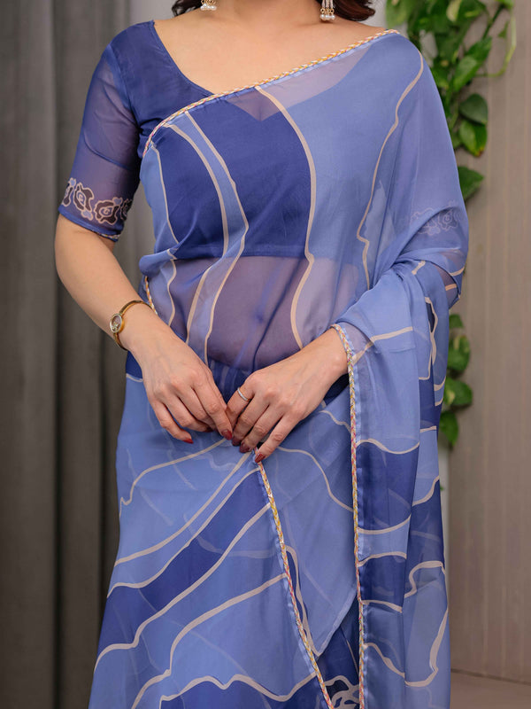 Steel Blue Printed Organza Saree with Abstract Wave Motifs & Multicolour Lace Border | Designer Lightweight Organza Saree with Attached Blouse Piece | Contemporary Festive Wear Saree