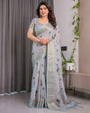 Ice Grey Handloom Linen Saree with Floral Print, Gold Zari Border & Tassel Detailing | Attached Blouse Piece | 5.5m Saree + 0.8m Blouse