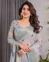 Ice Grey Handloom Linen Saree with Floral Print, Gold Zari Border & Tassel Detailing | Attached Blouse Piece | 5.5m Saree + 0.8m Blouse