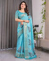 Turquoise Blue Handloom Linen Saree with Floral Digital Print & Golden Zari Border | Tassel Detailing | Attached Blouse | 5.5m Saree + 0.8m Blouse