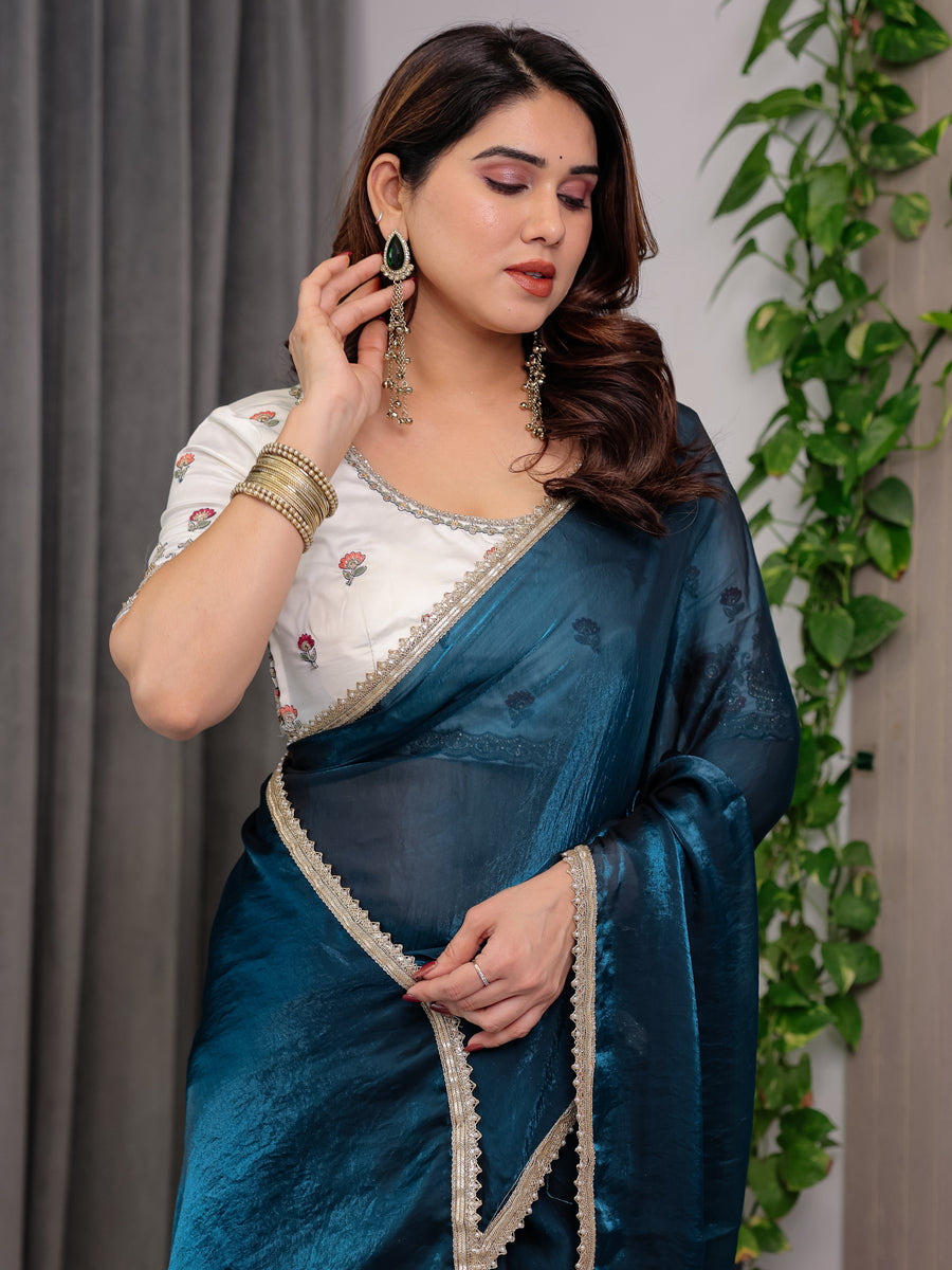 Deep Teal Fendy Satin Designer Saree with Pearl Lace Border & Tassel Pallu | Premium Shimmer Satin Saree with Heavy Floral Embroidered Ivory Blouse | Wedding & Festive Wear Saree