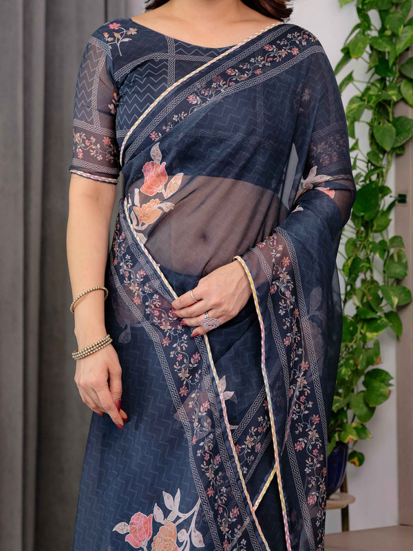 Midnight Blue Floral Printed Organza Saree with Floral Border & Multicolour Lace Edges | Designer Lightweight Organza Saree with Attached Blouse Piece | Festive & Party Wear Saree