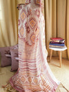 Ivory Linen Saree with Geometric Tribal Prints & Tassel Accents