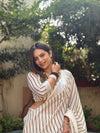 Elegant Off-White Pure Linen Digital Printed Saree with Striped Design and Unique Black Motif Pallu – Comes with Blouse Piece and Tassels